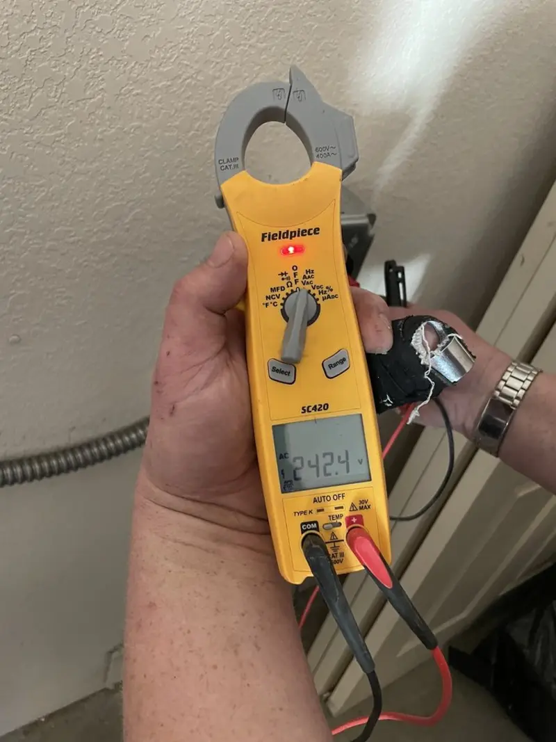 Voltage testing with clamp meter during Generator Installation in West Haven-Sylvan